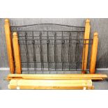 A contemporary wood and wrought iron king size bed frame, W. 165cm.