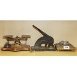 An early wood and brass post office scale together with a sovereign scale, a brass ink stand and