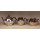 A 19th century Royal Doulton stoneware harvest pattern three piece tea set, tea pot H. 11cm. (