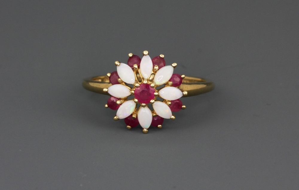 A hallmarked 9ct yellow gold ring set with marquise cabochon cut opals and rubies, (O.5). - Bild 3 aus 4