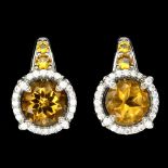 A pair of 925 silver earrings set with round cut citrines, L. 1.6cm.