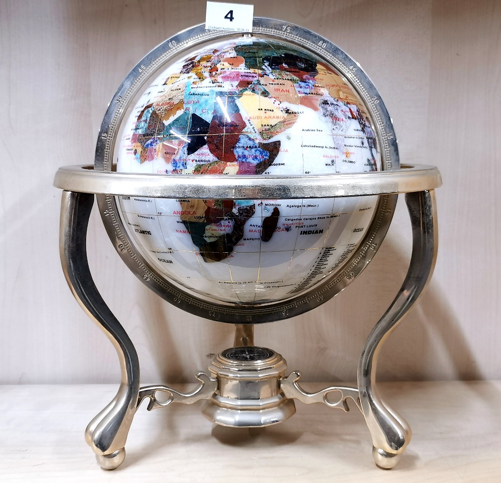 A mother of pearl and semi precious stone inlayed globe, H. 37cm.