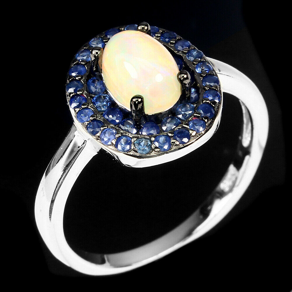 A 925 silver cluster ring set with cabochon cut opal and two rows of sapphires, (O). - Bild 2 aus 2