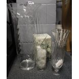 A very large handmade glass vase, H. 60cm, together with a Dartington vase and two others.