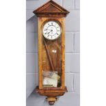 A 19th Century polished pine Vienna style wall clock with repair receipt etc, H. 113cm.