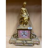 A 19th C French gilt metal mantel clock with porcelain dial and detail, H. 49cm.