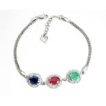 A 925 silver bracelet set with oval cut emerald, ruby and sapphire, L. 17cm.