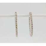 A pair of 18ct white gold large diamond set hoop earrings, Dia. 3.4cm. (laser etched 750) diamond