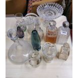 A pair of cut crystal decanters and other glassware.