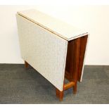 A 1960's Formica topped drop leaf dining table, closed size 91 x 27cm. Opening to 132cm.