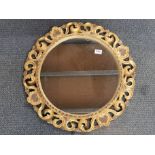 A circular gilt wood mirror, Dia. 61cm.