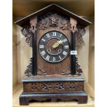 A 19th C carved oak black forest mantel cuckoo clock, H. 51cm.