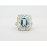 An 18ct white gold ring (stamped 0.750) set with an emerald cut aquamarine (approx. 5.5ct) and