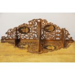 A lovely 19th Century fretworked and inlaid olive wood corner bracket, H. 84cm.