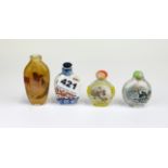 A group of three Chinese inside painted snuff bottles and one porcelain snuff bottle.