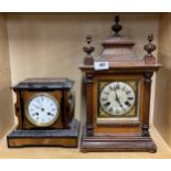 An oak striking mantel clock together with an ebony and burr wood mantel clock, largest H. 41cm.