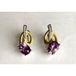 A pair of 925 silver gilt earrings set with oval cut amethyst and white stones, L. 2cm.