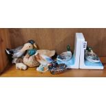 A pair of Otagiri porcelain duck bookends with a Hummell duck and others.