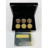 A cased set of twelve 24ct gold finished and enamelled Imperial one crown coins.