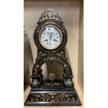 A 19th C brass and mother of pearl inlaid lacquered striking mantel clock, H. 49cm.