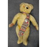 A large antique articulated teddy bear, H. 71cm.