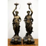 A pair of superb bronze and black slate figural lamp bases of classical female figures after L.