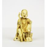 A 19th Century Japanese carved ivory figure, H. 8cm.