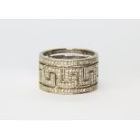 A large 9ct white gold (stamped 9k) ring set with diamonds, (T).