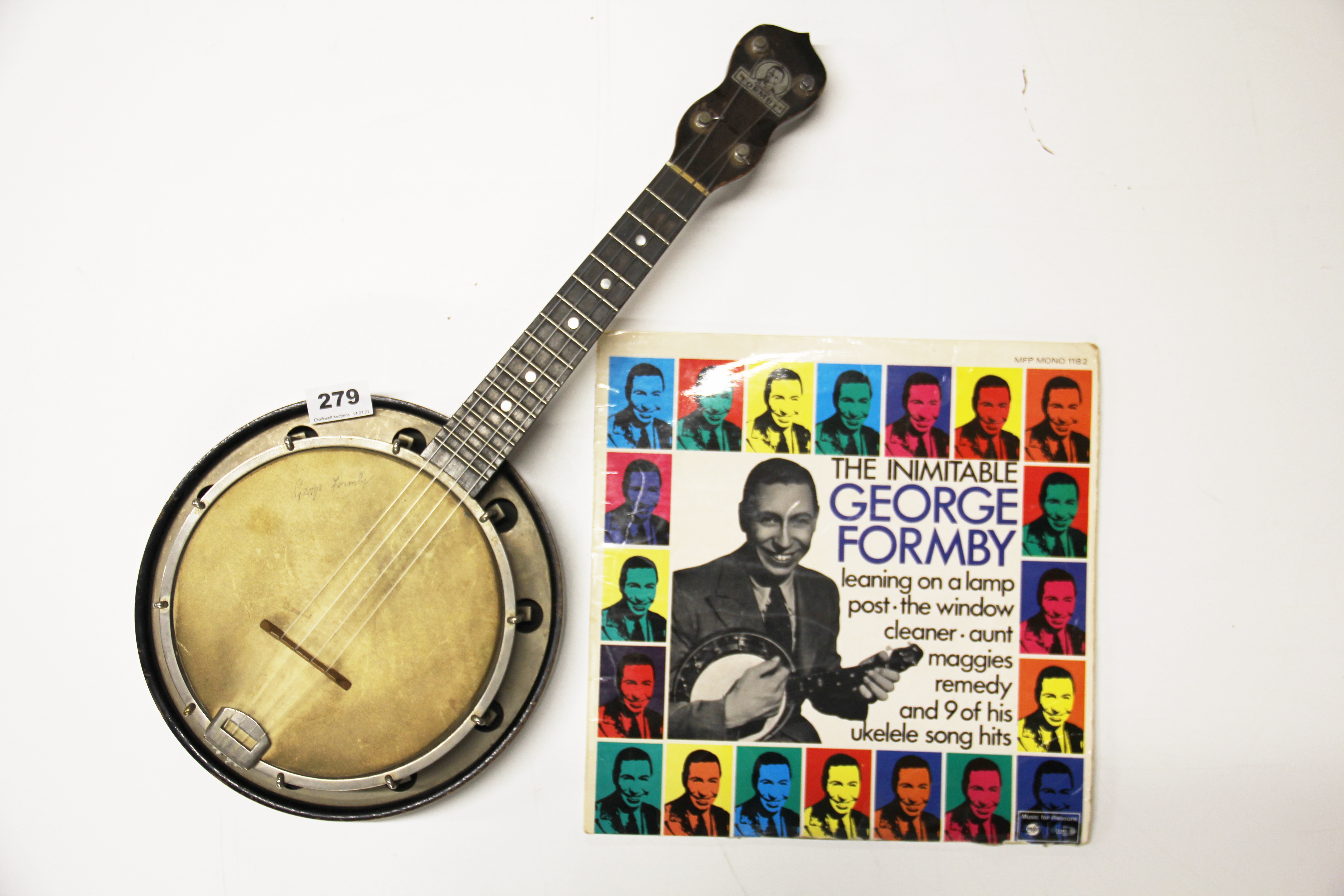 A signed George Formby ukulele banjo and record.