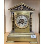 A 19th C gilt brass classical mantel clock by Maple & Co Paris with striking movement, H. 31cm.