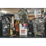 Cinematic interest: A collection of horror movie related items including, a figure of Leatherface, a