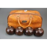 A competition set of hardwood bowls with silver insets dated 1934.