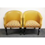 A pair of re-upholstered 1930's leather covered tub chairs.