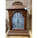 An early 20th C oak cased chiming bracket clock, H. 48cm. Appears to be in working order.