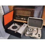 A Bush vintage radio with a reel to reel tape recorder and portable recorder player.