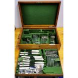An oak cutlery case and contents.