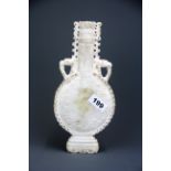 An interesting Chinese carved white jade/ hardstone archaic form urn with phoenix head handles, H.