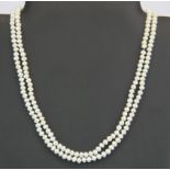 A two strand necklace of cultured pearls on a 9ct gold clasp.