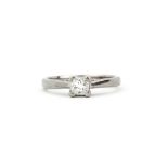 A hallmarked 18ct white gold solitaire ring set with a princess cut diamond, approx. 0.33ct, (K).