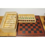 An impressive collectors chess set and board (resin), king H. 19cm.