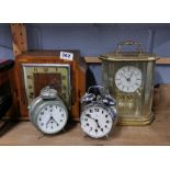 An Art Deco mantel clock and three others.