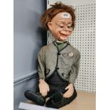 A celluloid ventriloquist dummy, H. 65cm.