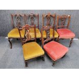 A group of mahogany dining chairs and nursing chairs.