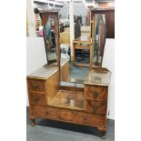 A 1930's Art Deco walnut veneered dressing table with plate glass protectors, W. 107cm. H. 168cm.
