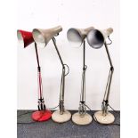 A group of four vintage anglepoise desk lights.