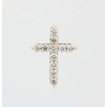 A 9ct white gold (stamped 9ct) cross pendant set with approx. 1ct of brilliant cut diamonds.