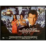 A framed James Bond 007 movie film poster for Tomorrow Never Dies. Frame size H. 105cm W. 180cm.