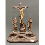A 1920's/30's four piece 'chalk' figure of the crucifixion, H. 50cm.