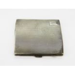 An Art Deco Chester hallmarked silver cigarette case with engine turned decoration, 8 x 8.5cm