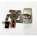 A box of mixed interesting items, including Max Mara sunglasses.